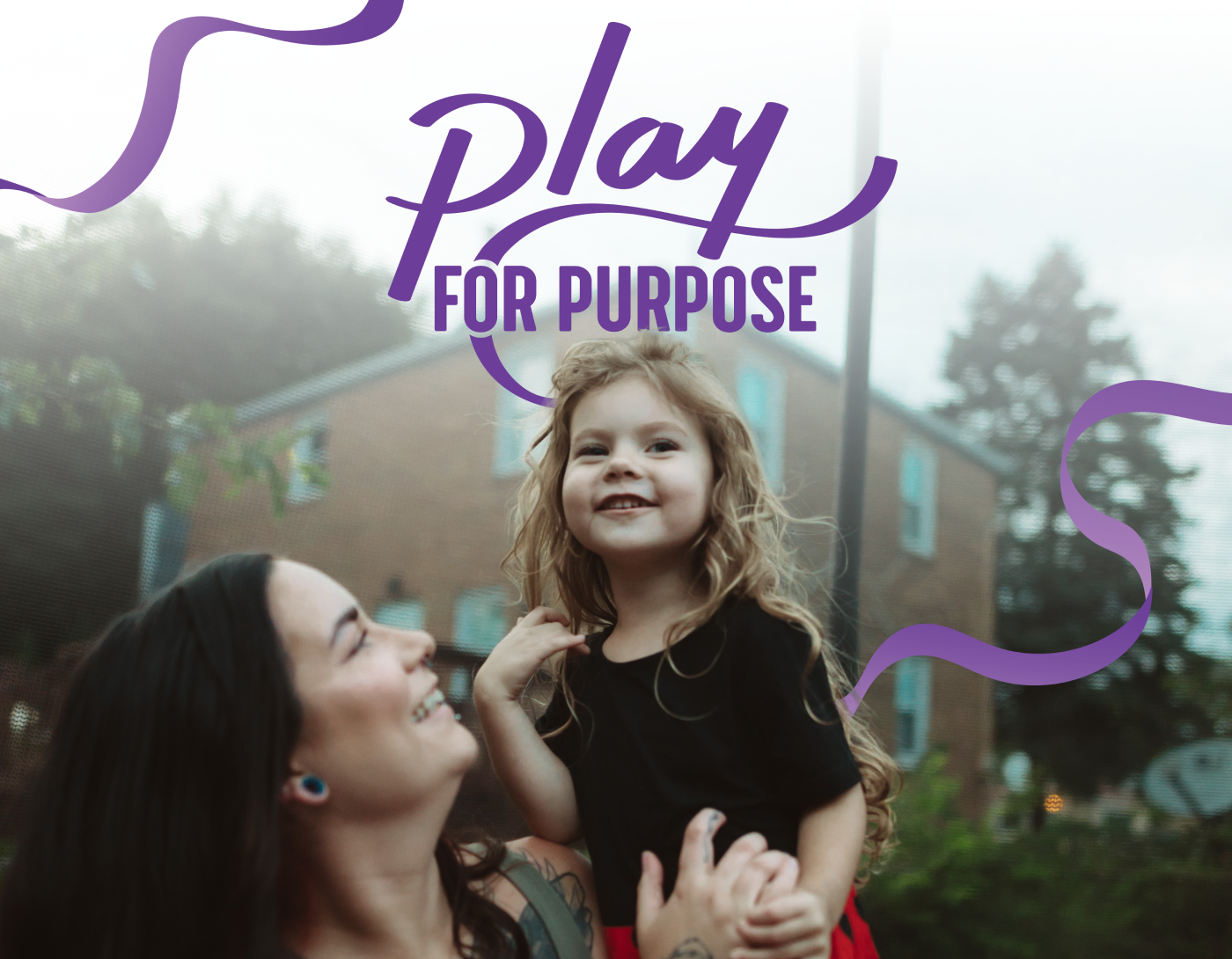 Play for purpose header - woman holding little girl