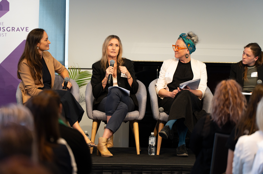 Four women speaking on a panel at the Annual Forum