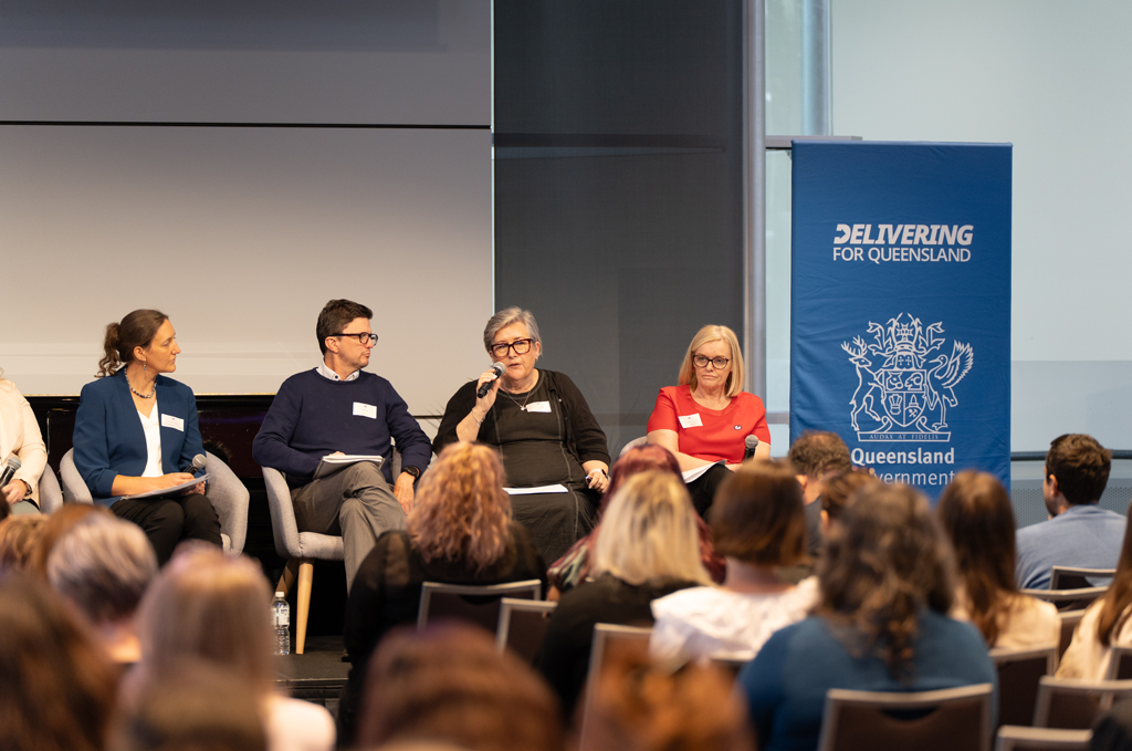 Corinne Harper speaking on a panel at the Annual Forum